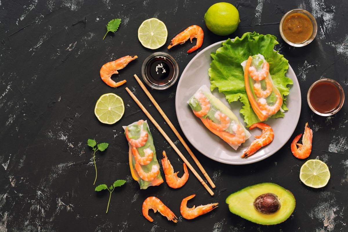 Spring rolls with shrimp on black concrete background . Asian traditional food. The concept of Asian food. Top view, copy space